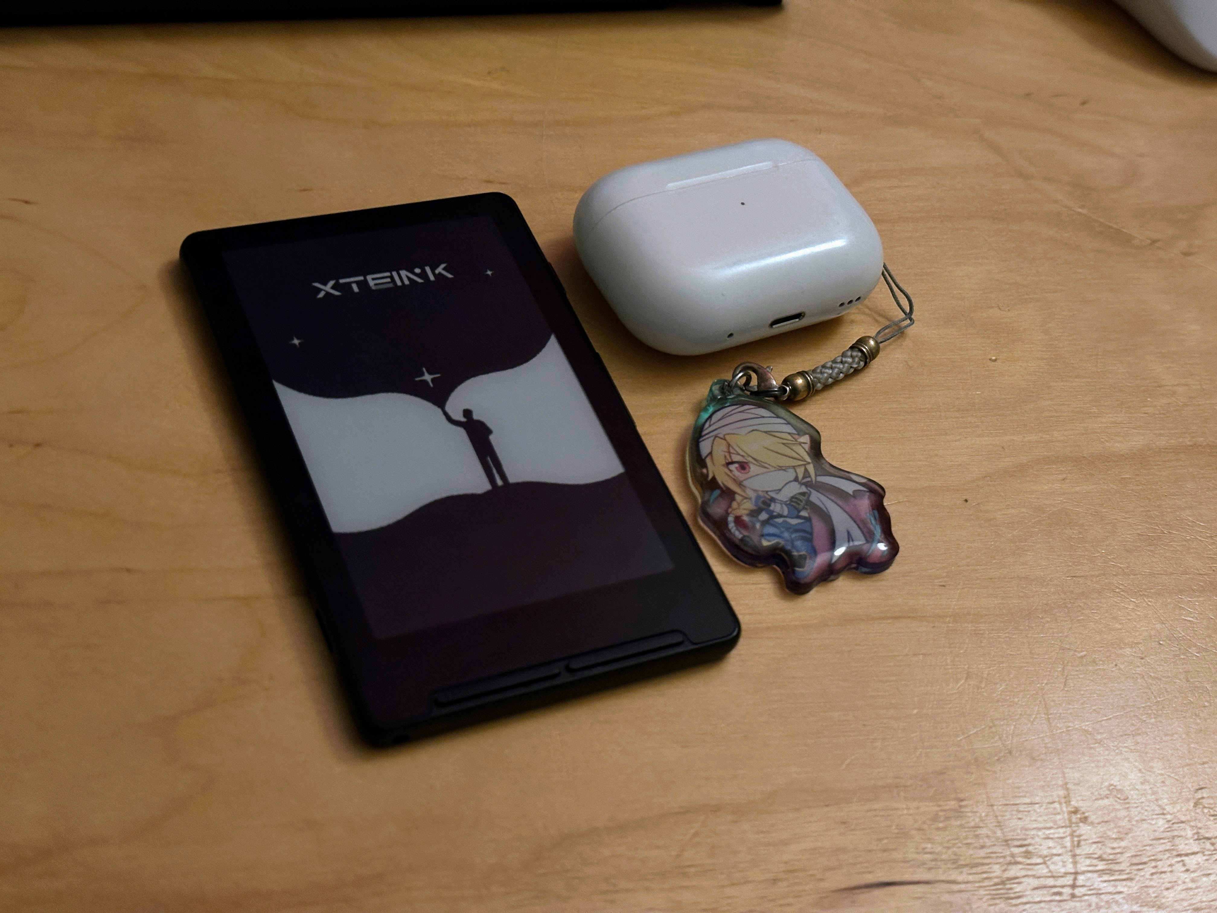 Xteink X4 next to Airpods Pro Case